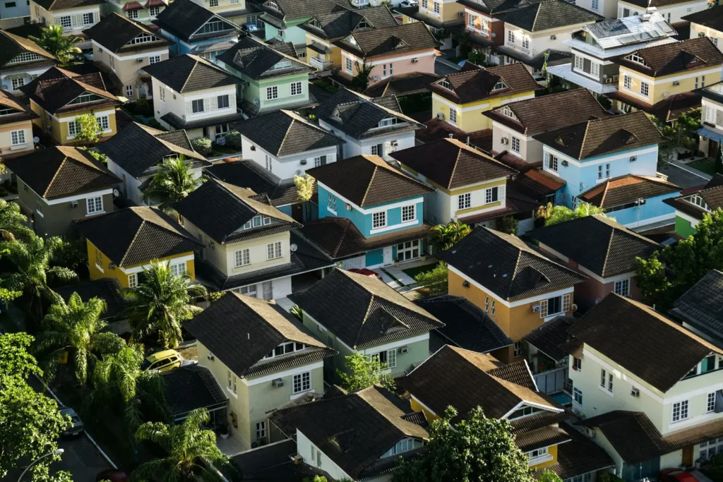 Aerial view of residential rooftops with AC units