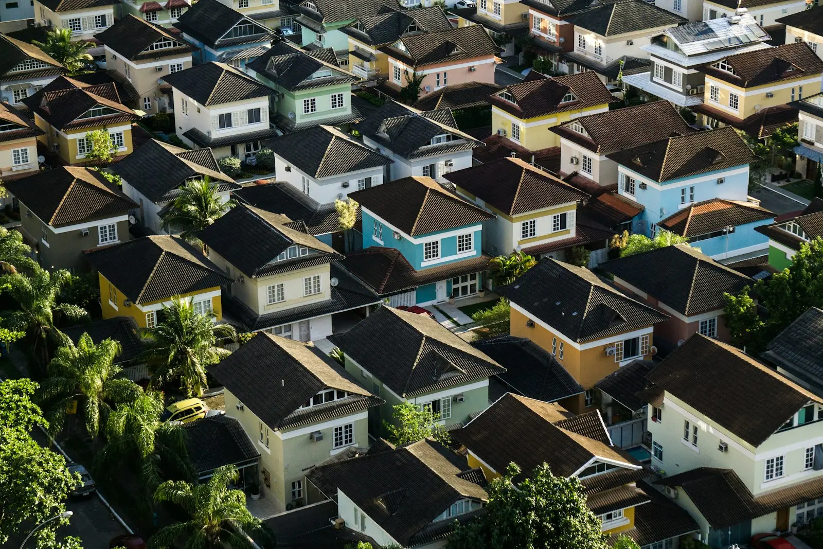 Aerial view of residential rooftops with AC units